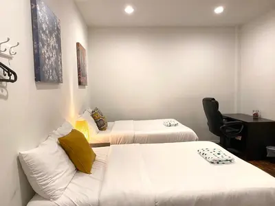 a hotel room with two beds and a desk at AF Stays - Philadelphia Convention Center in Philadelphia
