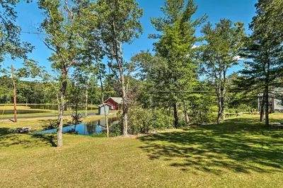 a view of a park with a house and a pond at Relax Fireside! Retreat 16 Mi to Camelback Resort in Saylorsburg