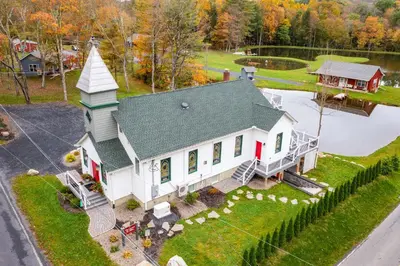 an aerial view of a house with a church at 16 Mi to Ski Slopes! Creekside Poconos Cottage in Brodheadsville