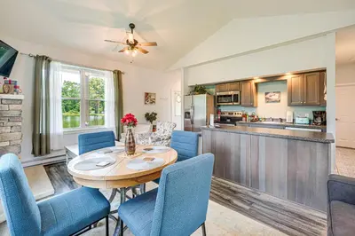 a kitchen and dining room with a table and chairs at Close to Slopes Lakeside Cottage in Pocono Mtns in Brodheadsville