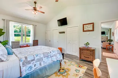 a bedroom with a bed and a ceiling fan at Close to Slopes Lakeside Cottage in Pocono Mtns in Brodheadsville