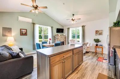 a kitchen and living room with a large island at Close to Slopes Lakeside Cottage in Pocono Mtns in Brodheadsville