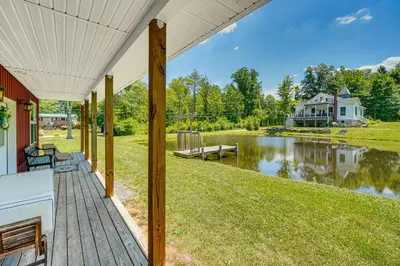 a view from the porch of a home with a pond at Close to Slopes Lakeside Cottage in Pocono Mtns in Brodheadsville