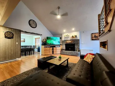 a living room with a couch and a tv at Paradise in heart of Poconos FaSt InTeRnEt Close to All Attractions in Pocono Summit
