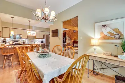 a dining room and kitchen with a table and chairs at Walk to Dining! Townhome 1 Mi to Big Boulder Mtn in Lake Harmony
