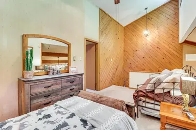 a bedroom with a bed and a dresser and a mirror at Walk to Dining! Townhome 1 Mi to Big Boulder Mtn in Lake Harmony