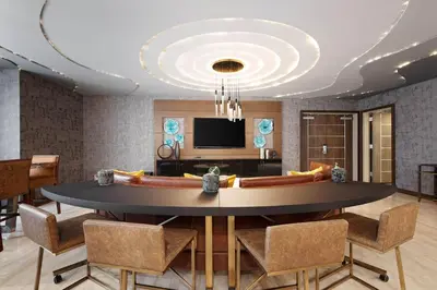 a dining room with a large table and chairs at Element New York Wood Ridge in Wood-Ridge