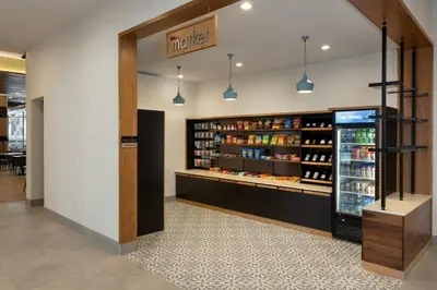 a grocery store aisle with a refrigerator and drinks at Residence Inn By Marriott Philadelphia Bala Cynwyd in Bala-Cynwyd