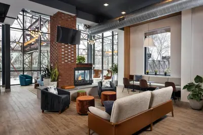 a lobby with couches and a fireplace and a tv at Residence Inn By Marriott Philadelphia Bala Cynwyd in Bala-Cynwyd