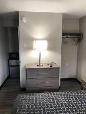 a bedroom with a bed and a lamp on a dresser at Trolley Stop Motel, Media ,Near PHL Airport PA in Media