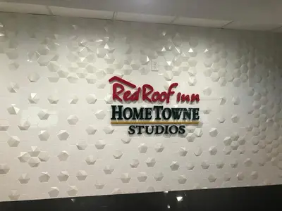 a red rock iowa havelove studios sign on a wall at HomeTowne Studios by Red Roof Bordentown - McGuire AFB in Bordentown