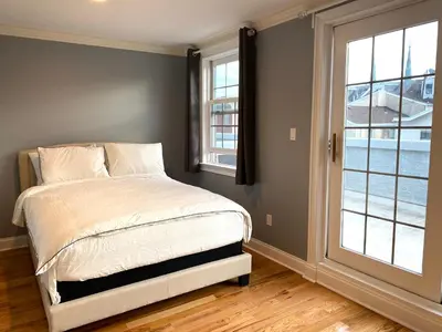 a bedroom with a bed and a large window at AF Stays - Philadelphia 1212 Mt Vernon St in Philadelphia