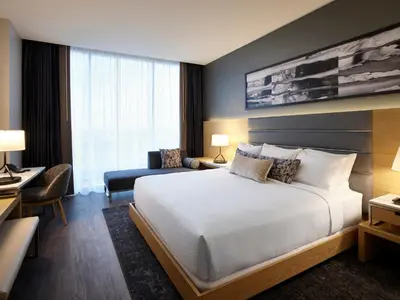 a hotel room with a bed and a desk at Live! Casino & Hotel - Philadelphia in Philadelphia