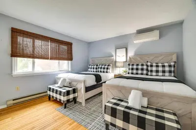a bedroom with two beds and a window at Hot Tub, Fire Pit and Resort Perks Tobyhanna Home! in Tobyhanna