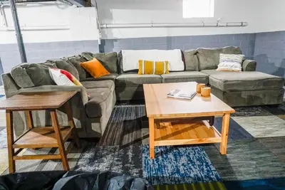 a living room with a couch and a table at Camelback Rd Rancher- On ONE ACRE & near attractions in Tannersville