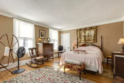 a bedroom with a bed and a table and chairs at 11 Mi to Jack Frost Resort Winter Family Getaway! in White Haven