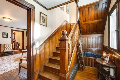 a staircase in a home with wooden walls and wooden floors at 11 Mi to Jack Frost Resort Winter Family Getaway! in White Haven