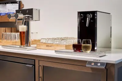 a counter with two glasses of wine on it at Element Valley Forge King of Prussia in King of Prussia