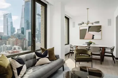 a living room with a couch and a table at Arlo Midtown in New York
