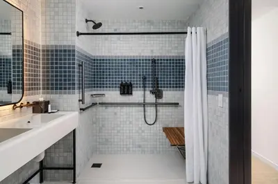 a bathroom with a shower and a sink at Arlo Midtown in New York