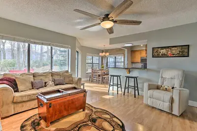 a living room with a couch and a ceiling fan at On Big Boulder Lake Condo with Community Pools! in Lake Harmony
