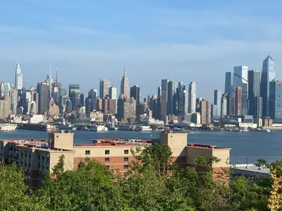 a view of a city skyline with buildings and water at Nice 2 bedrooms, Massage Seat, close to New York, THE BEST CHOICE!! in North Bergen