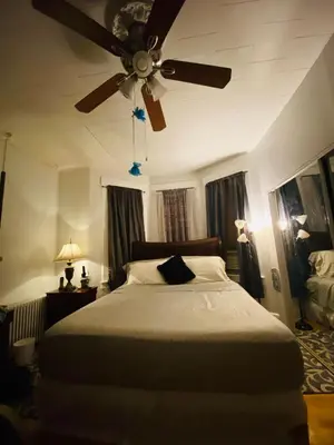 a bedroom with a bed with a ceiling fan at Nice 2 bedrooms, Massage Seat, close to New York, THE BEST CHOICE!! in North Bergen