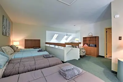 a large bedroom with two beds and a dresser at LAKEFRONT Penthouse at Jack Frost Big Boulder in Lake Harmony