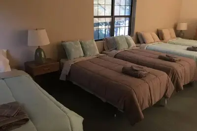 a room with three beds with pillows on them at LAKEFRONT Penthouse at Jack Frost Big Boulder in Lake Harmony
