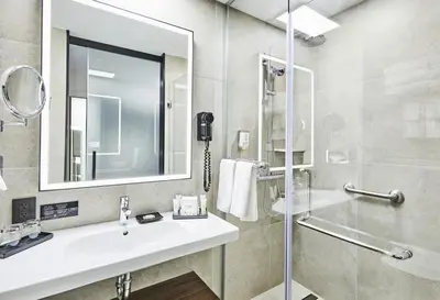 a bathroom with a sink and a shower at Riu Plaza Manhattan Times Square in New York