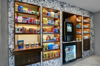 a refrigerator filled with lots of food at Courtyard by Marriott Hamilton in Hamilton