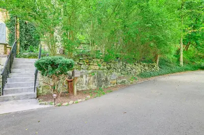 a stone retaining wall with stairs and a stone fence at Charming Getaway Less Than 1 Mi to Downtown Lambertville! in Lambertville