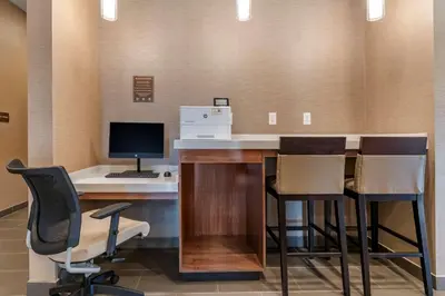 an office with a desk with a computer and chairs at Comfort Suites Camp Hill-Harrisburg West in Harrisburg