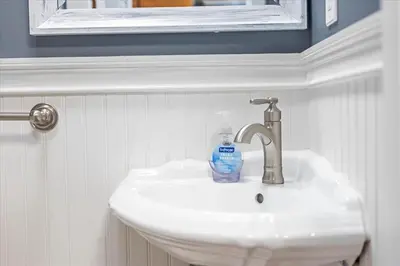 a bathroom sink with a bottle of soap on it at 180 SKI CAMELBACK-SKI-ON -SKI OFF,SNOW TUBING,Paintball in Tannersville