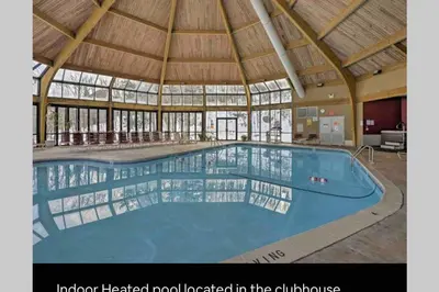 a large swimming pool in a building with a roof at 180 SKI CAMELBACK-SKI-ON -SKI OFF,SNOW TUBING,Paintball in Tannersville