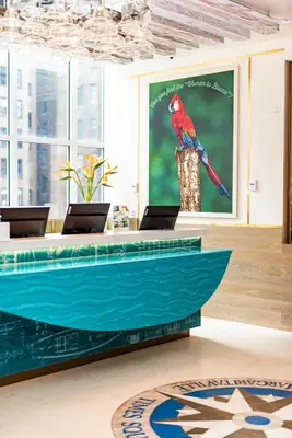 a colorful bird sitting on a table in a room at Margaritaville Resort Times Square in New York