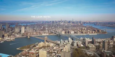 an aerial view of a large city with a bridge at Leon Hotel LES in New York
