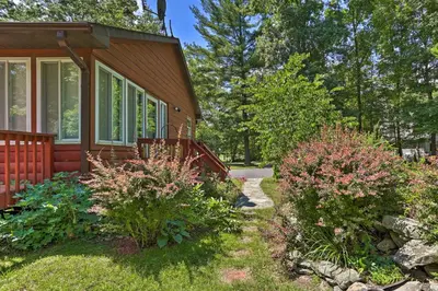 a home with a pathway leading to the front yard at Hike and Ski Log Cabin in East Stroudsburg! in East Stroudsburg