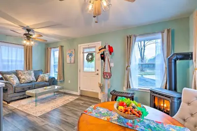 a living room with a couch and a table at Unwind Fireside! Poconos Cottage 12 Mi to Slopes in Brodheadsville