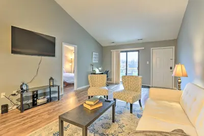 a living room with a couch and a table at Inviting Poconos Getaway with Deck Ski and Hike! in Mount Pocono