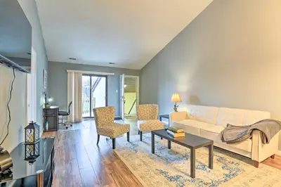a living room with a white couch and chairs at Inviting Poconos Getaway with Deck Ski and Hike! in Mount Pocono
