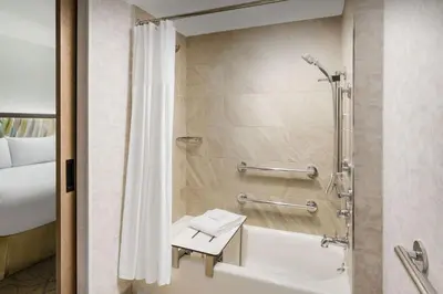 a bathroom with a tub and a shower with a toilet at TownePlace Suites by Marriott New York Manhattan/Chelsea in New York