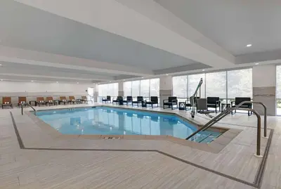 a large swimming pool in a hotel room at Homewood Suites By Hilton Edison Woodbridge, NJ in Edison