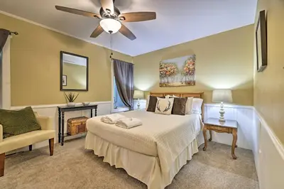 a bedroom with a bed and a ceiling fan at Cozy Poconos Townhome with Fireplace Near Jack Frost in Lake Harmony