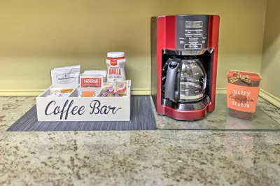 a coffee station with a coffee maker and a coffee box at Cozy Poconos Townhome with Fireplace Near Jack Frost in Lake Harmony