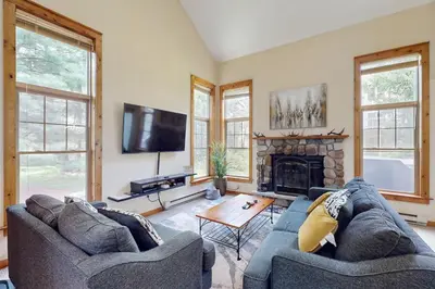 a living room with two couches and a fireplace at Northridge 181 in Tannersville