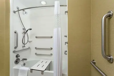 a bathroom with a shower and a sink at Hampton Inn & Suites Williamsport - Faxon Exit in Williamsport