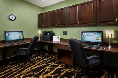 an office with two desks with two computers on them at Hampton Inn & Suites Williamsport - Faxon Exit in Williamsport
