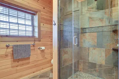 a bathroom with a shower with a glass door at Quiet Snow Estate Retreat in the Poconos in Nay Aug