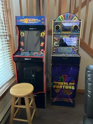 two arcade games next to a video game console and a stool at Camelback Private Home located behind Waterpark & Ski Lift in Tannersville